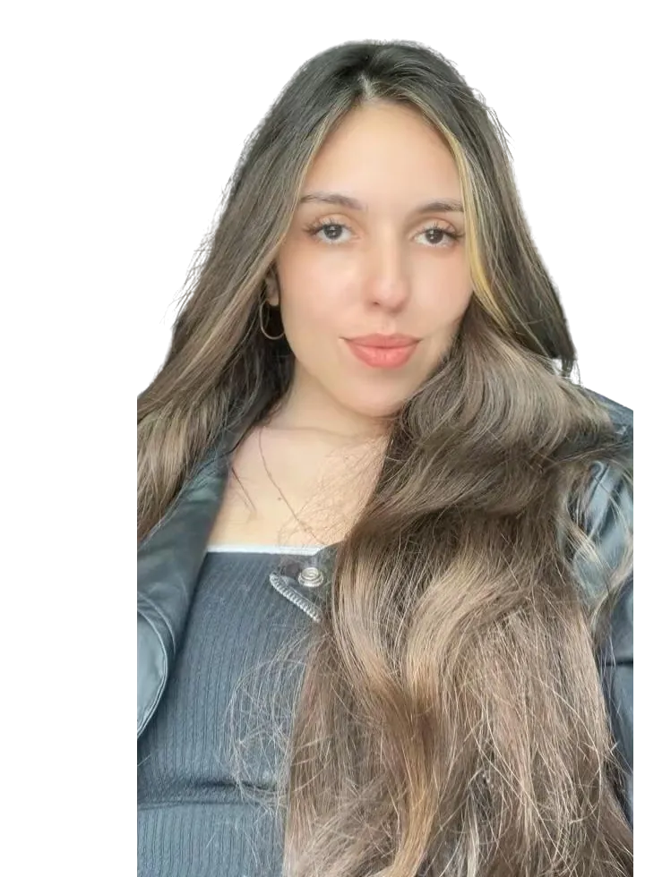 Nataly Maria, with long brown hair and a black leather jacket, looking at the camera